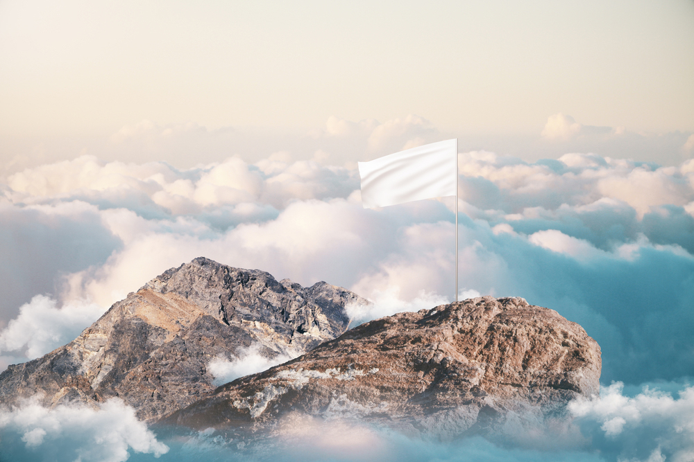 white flag on mountain top concept ownerships