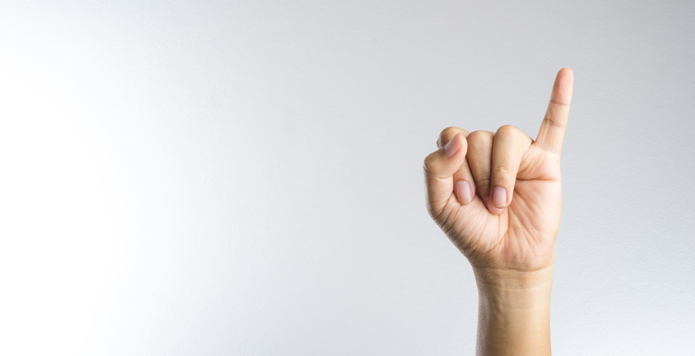 Person holding up a finger