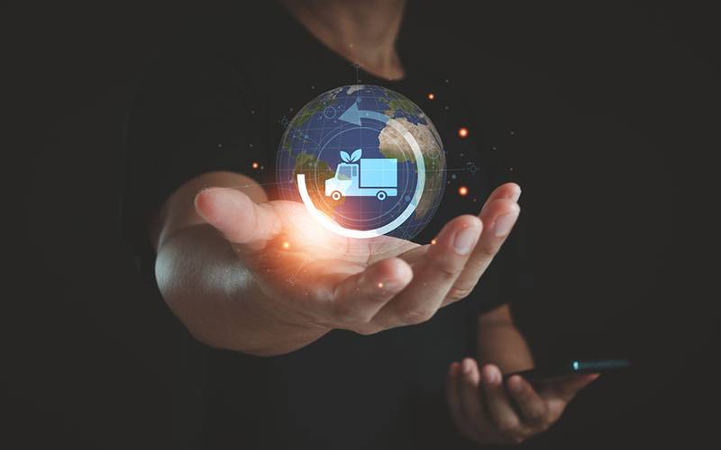 Hand holding a bubble with an circular arrow.