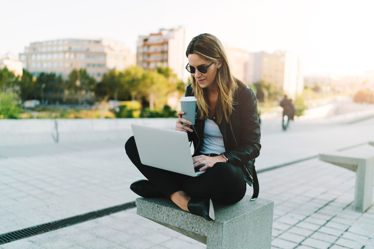 Woman with computer in her lap